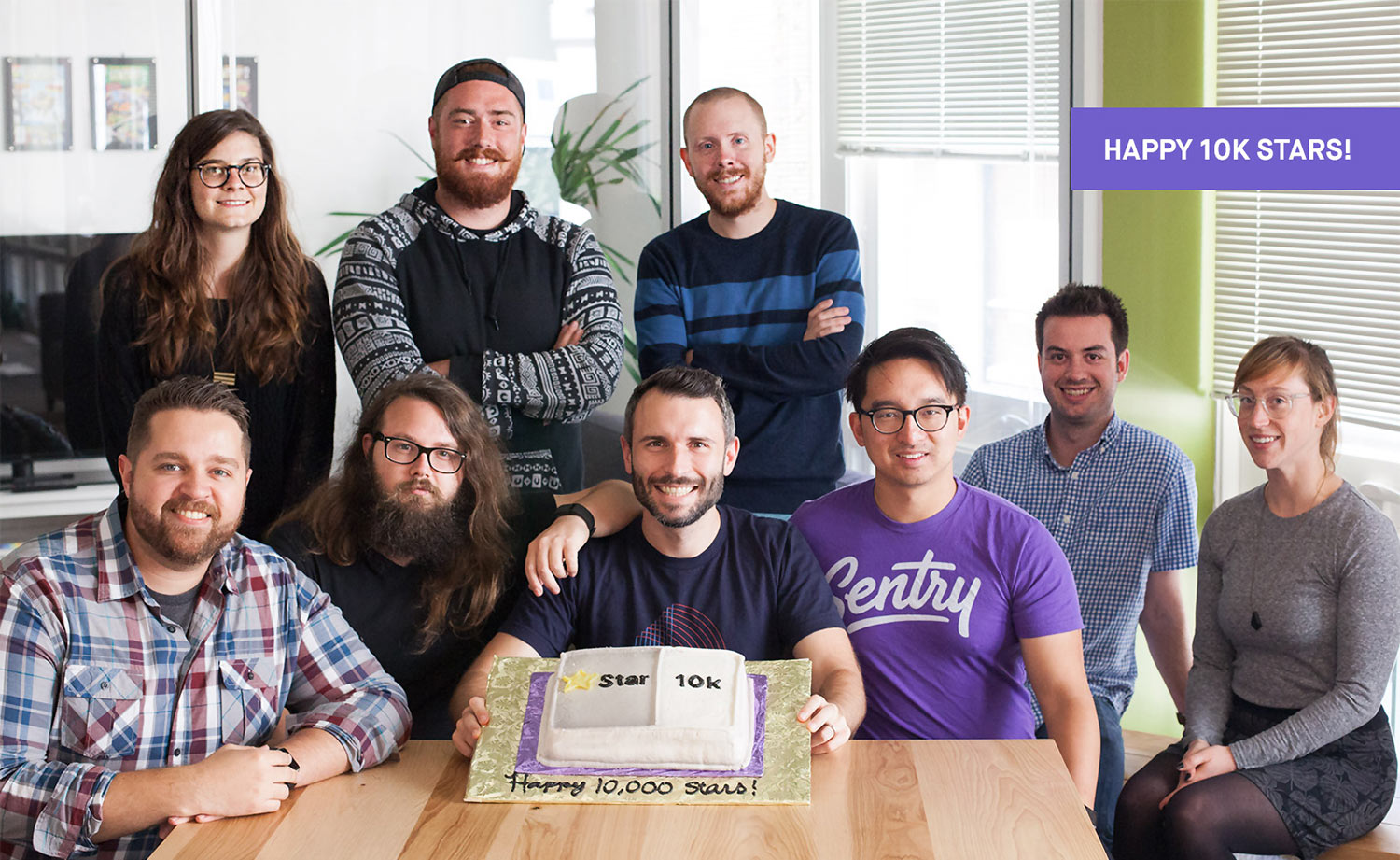 Sentry team members celebrating 10,000 GitHub stars with a custom cake